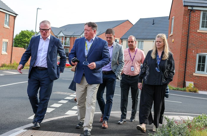 From left: Mayor Richard Parker joins Gary Fulford, CEO whg, Stuart Penn, Lovell, regional managing director, Cllr Gaz Ali and Rebecca Bennett Casserly, corporate director of development whg to see the recently completed Lockside development