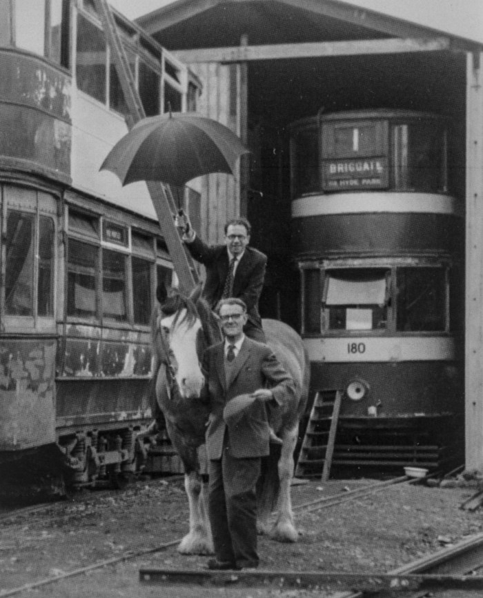 Geoffrey Claydon [top with umbrella] with Merlyn Bacon and Felix, the first tram horse at Crich in front of Leeds 399 and Leeds 180 in 1961. [courtesy of the National Tramway Museum/A K Terry]