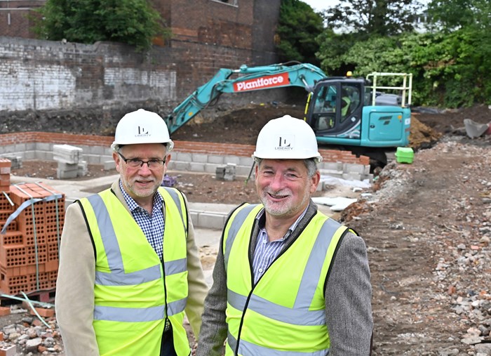 Alan Yates, chairman (left) and Mark Grady, managing director (right) of Liberty Developments on site at Wallows Road to see work get underway on 30 energy efficient homes that will be made available at affordable rents