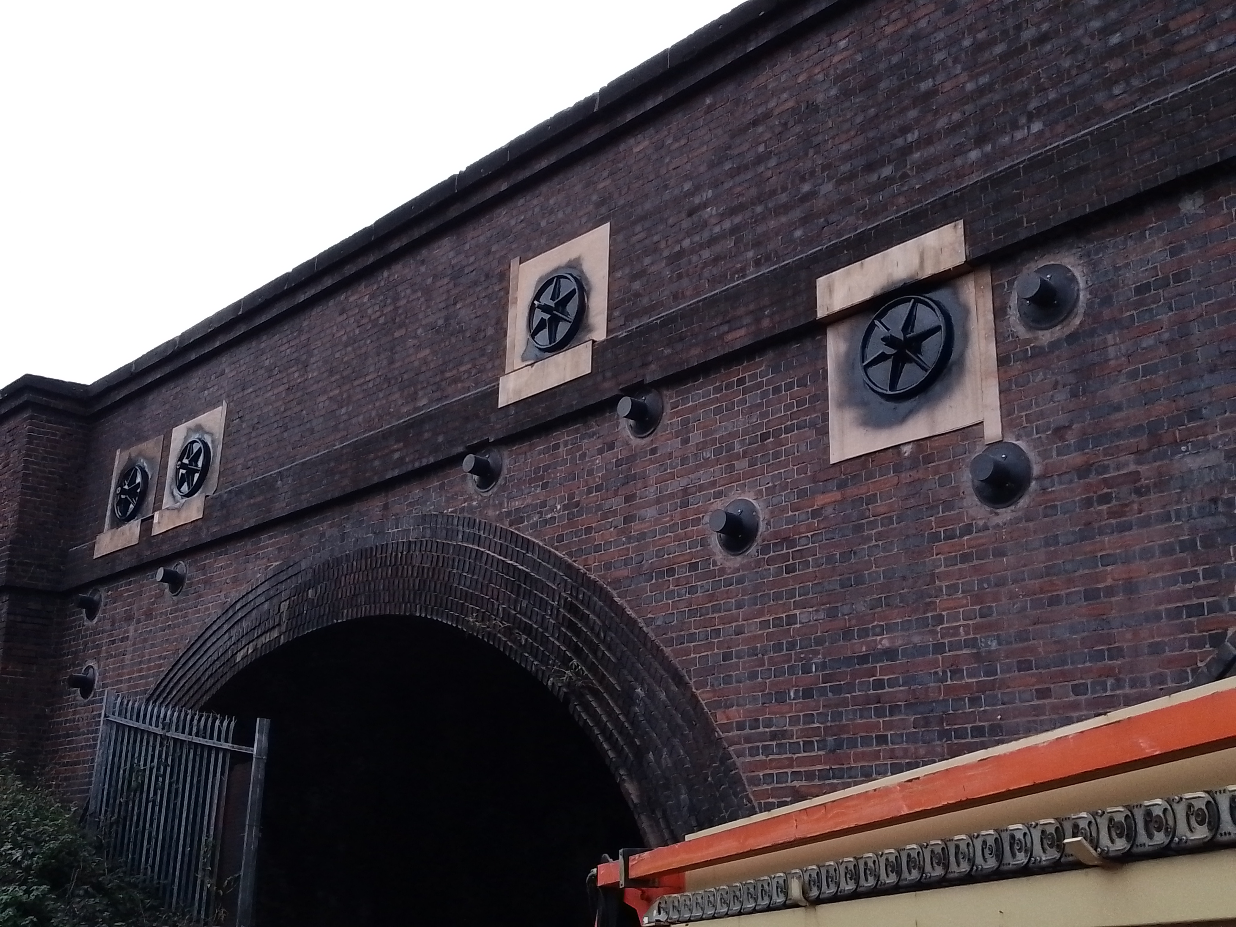 Image of the brick built viaduct with circular metal features