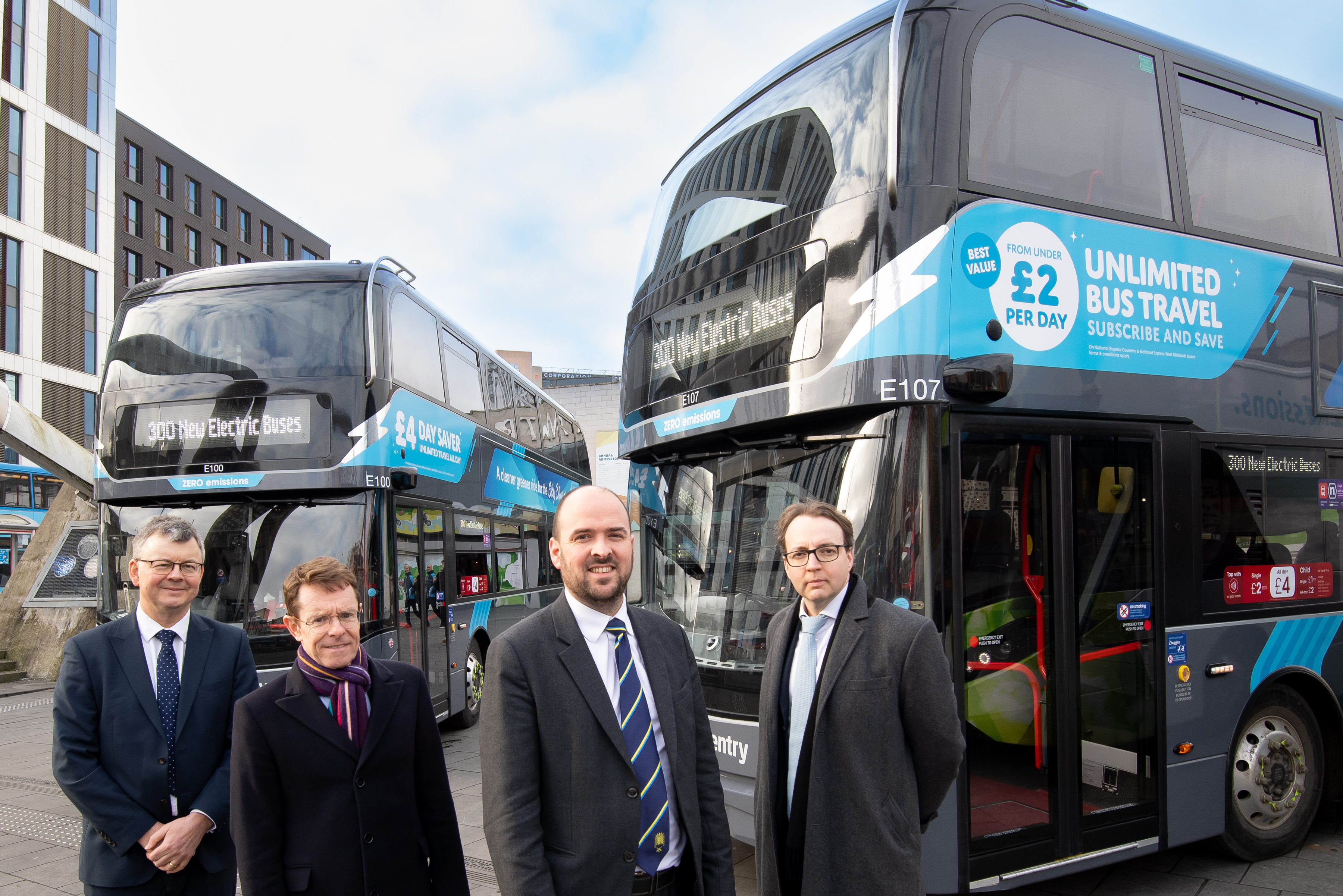 Two electric double decker buses with L-R: National Express UK CEO Tom Stables, Andy Street, Mayor of the West Midlands, Transport Minister Richard Holden and David Bradford, managing director, National Express West Midlands