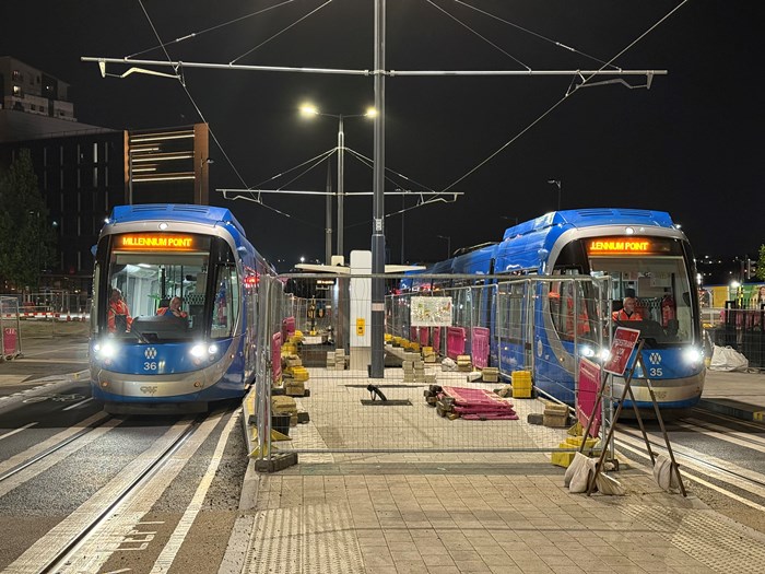 Two trams at a stop