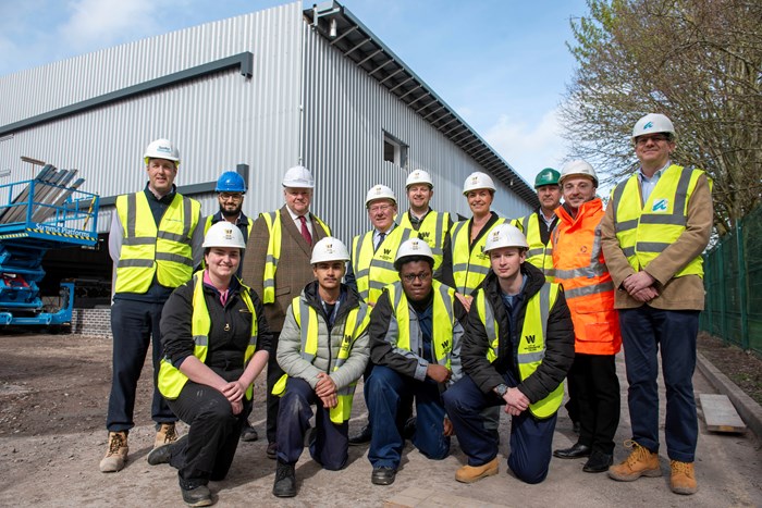 Outside the under-construction Advanced Technology and Automotive Centre are (L-R): Back row - Dave Sugden, Speller Metcalfe Project Manager, Ravi Verma, Turner & Townsend Project Manager, Cllr Stephen Simkins, City of Wolverhampton Council Leader, Cllr Bob Sleigh, Deputy Mayor of the West Midlands and WMCA portfolio holder for Finance, Peter Merry, City of Wolverhampton College Deputy CEO, Louise Fall, City of Wolverhampton Collage Deputy Principal, Steve Fitzpatrick, Speller Metcalfe Site Manager, Ryan Hunt, WMCA College Liaison, and Jonathan Astley, The Astley Partnership Architect. Front row – City of Wolverhampton College automotive students Olivia Mackay, Faizaan Ahmed, Antonio Keise and Jason Dawnes