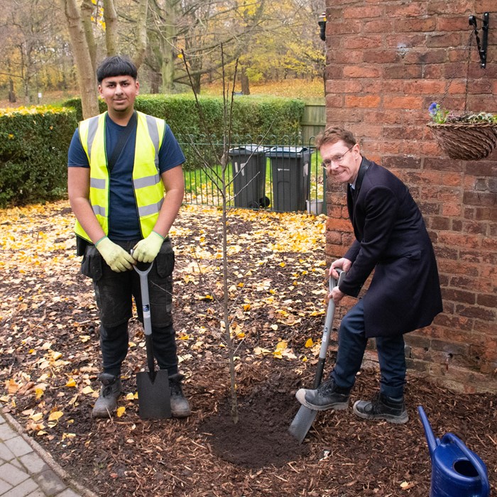 Andy Street, Mayor of the West Midlands and WMCA chair, planted a tree during a recent visit to WMCA Community Green Grant recipient Kingstanding Regeneration Trust. He is pictured with Asad Shahzad, a construction and landscaping trainee.