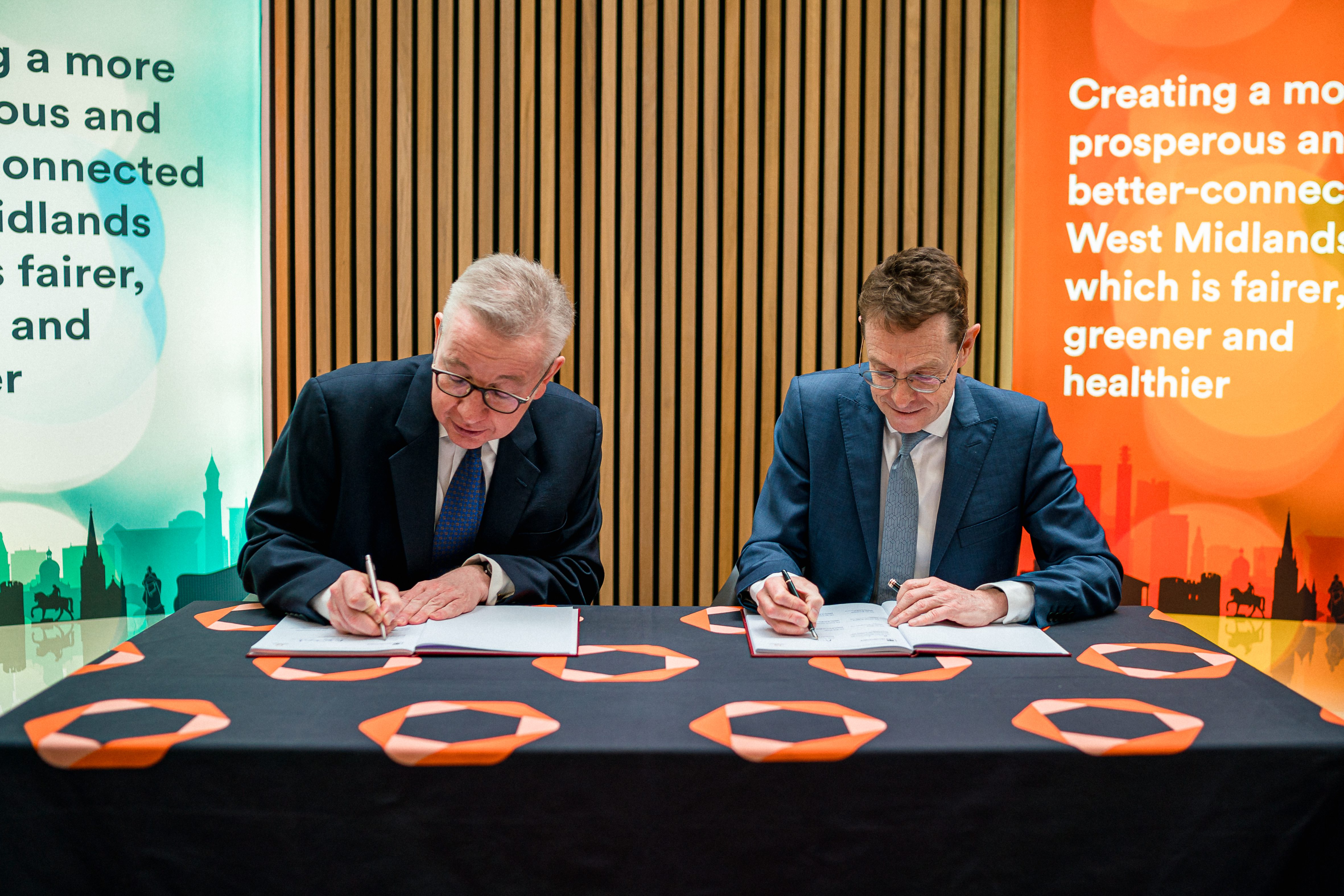 Levelling Up Secretary Michael Gove and Andy Street, Mayor of the West Midlands and chair of the West Midlands Combined Authority, put their signatures on the West Midlands Deeper Devolution Deal