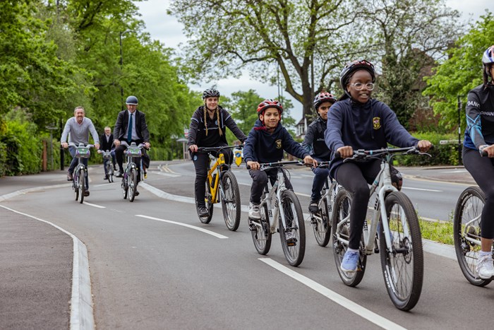 Group of primary school children riding bikes along the new cycleway