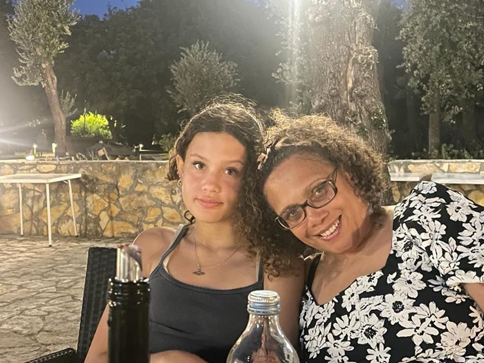 A photo of mother and daughter, Zoe and Megan, sitting outside