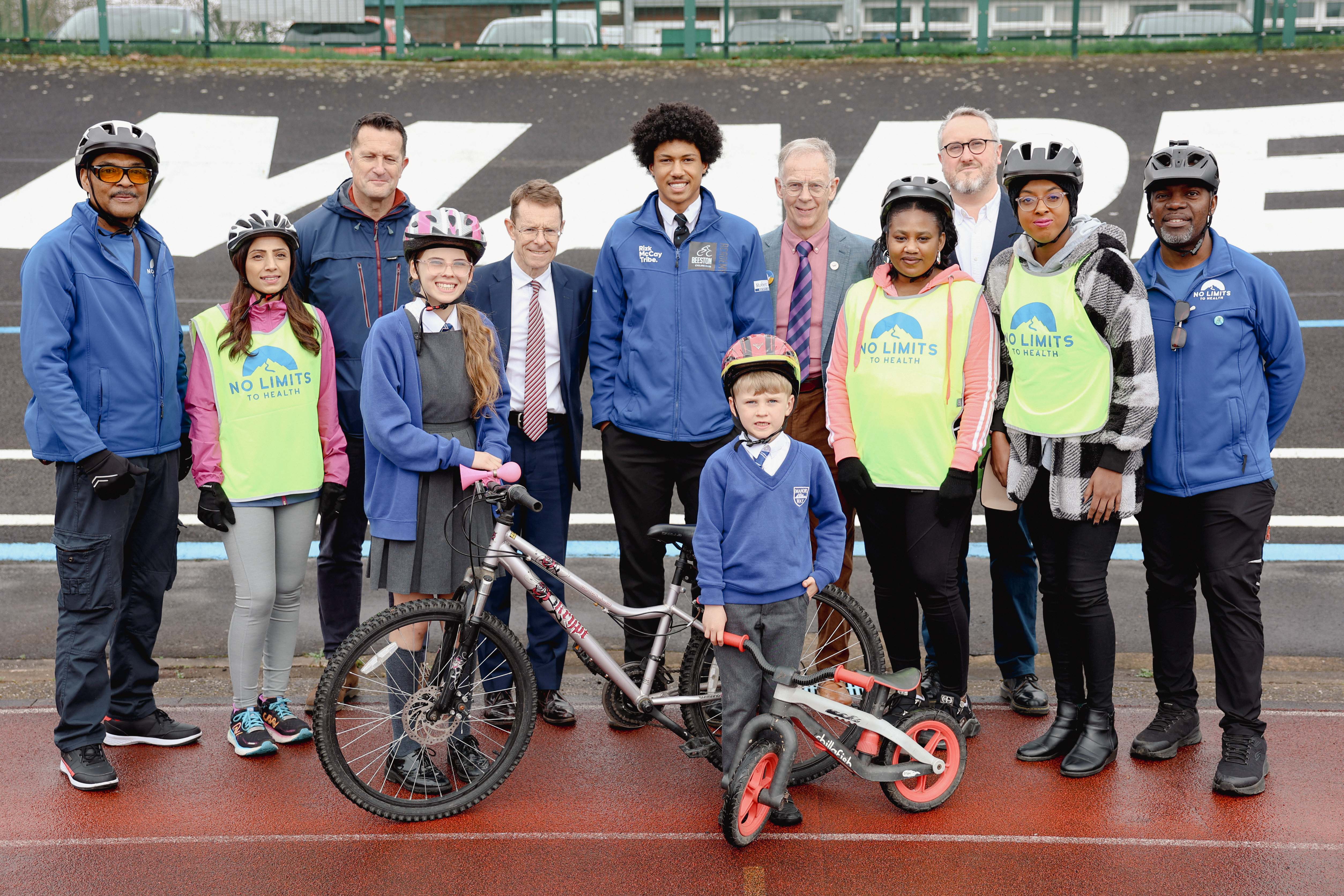 Dean Hill from Sport England, Mayor Andy Street, velodrome campaigner David Viner, Adam Tranter, the Mayor’s cycling and walking commissioner with cyclists Al Campbell, Harby Duggal, Street, Kristian Larigo, Tracy McLean, Chrystal Campbell, Sam Henry, Scarlett and Noah, front, at Halesowen Athletic and Cycling Club.