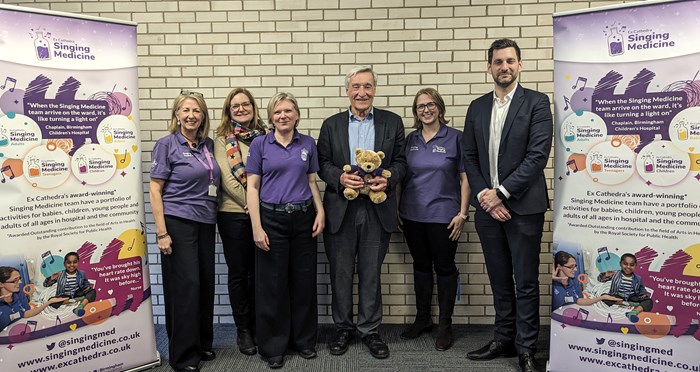 Julie Watson, Singing Medicine grants and individual giving manager; Laura Shoaf, WMCA chief executive; Rebecca Ledgard, Singing Medicine director of education and participation; Sir Vernon Ellis, chairman of New Philanthropy for Arts & Culture (NPAC) with Noah Bear, Singing Medicine mascot; Gemma King, Singing Medicine education and participation manager; and Alex Day, managing director of Big Give.
