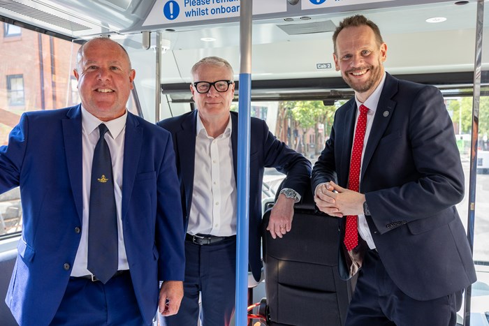 Three meen on board the Very Light Rail tram