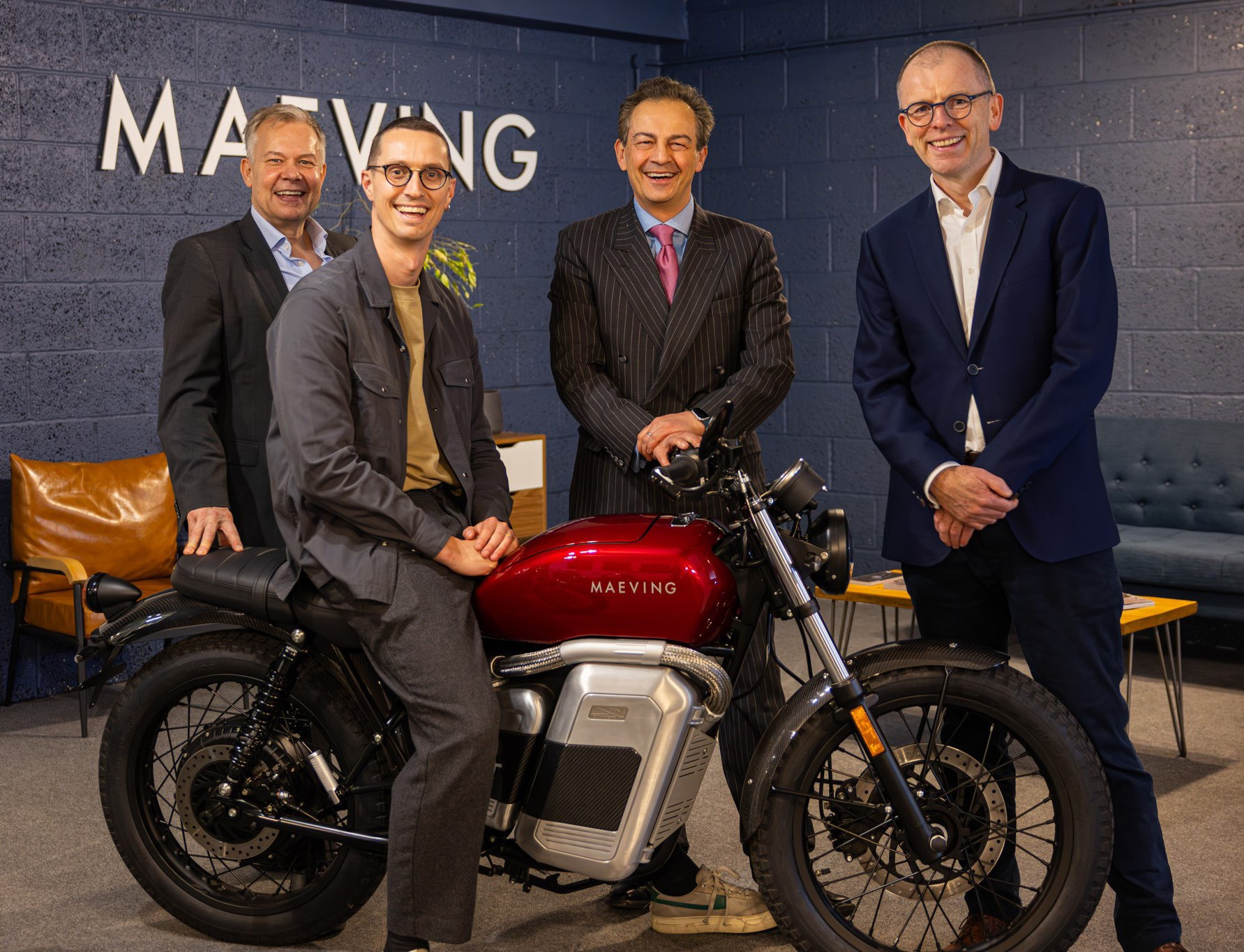 Maeving co-founder Sebastian Inglis-Jones on one of his company's bikes with (from left) Rupert Lyle, Investment Director and Fund Principal at Future Planet Capital, Douglas Hansen-Luke, Executive Chairman, Future Planet Capital and Mike Murray Real Estate Director, Rigby Group