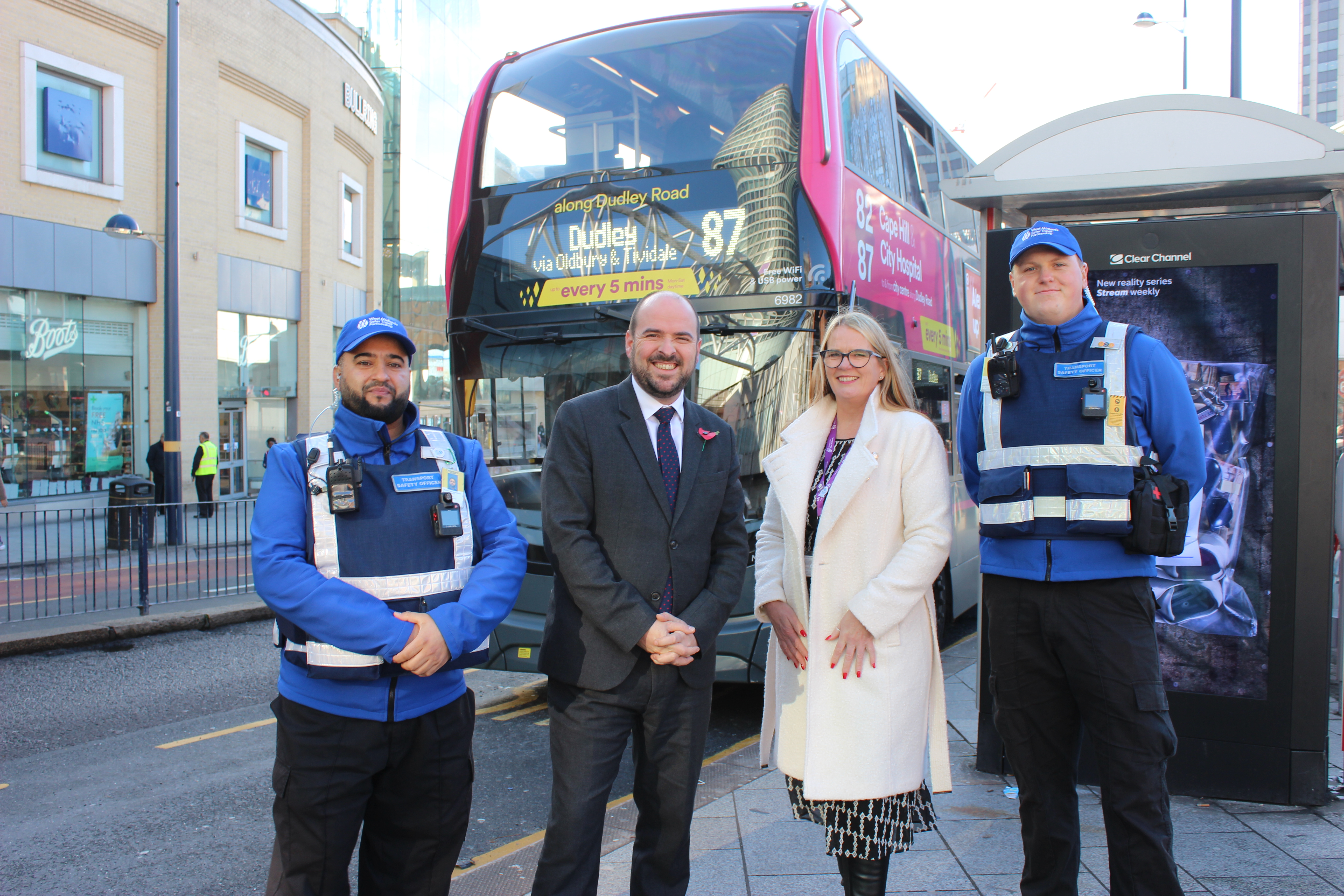 Transport minister Richard Holden with two TSOs and TfWM executive director Anne Shaw at the Smallbrook Queensway  bus stop in Birmingham city centre