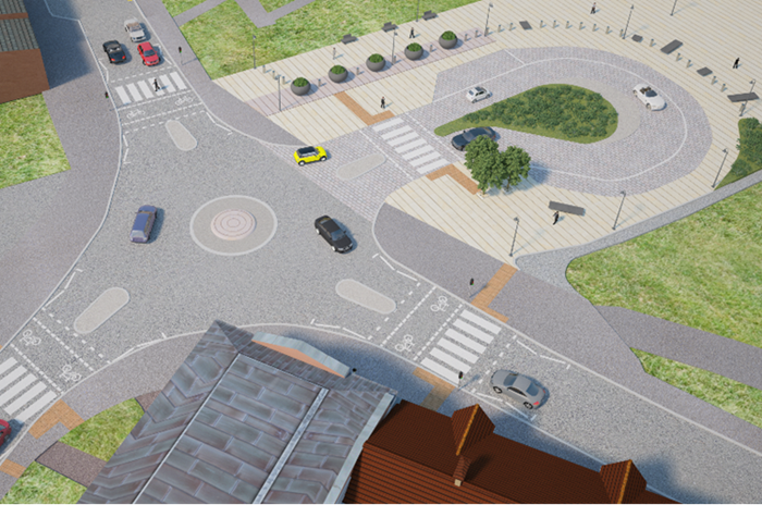 Design image showing aerial view with a mini roundabout at the centre of four roads. One of the roads to the top of the image is a turning loop creaing a drop-off for a public space outside the new railway station.
