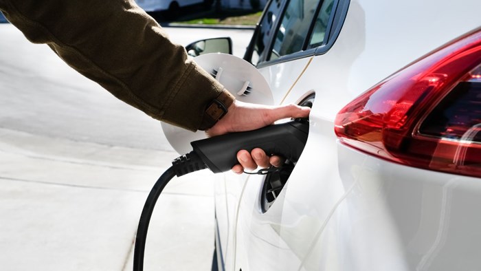 Generic photo of a white electric car being charged