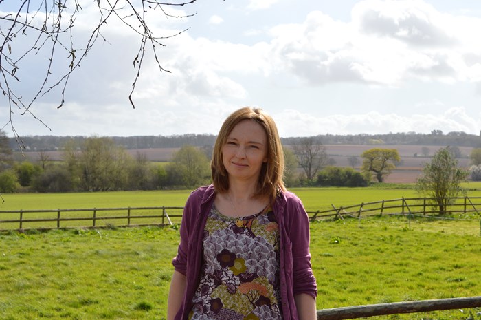 Rachel Phillips-Street standing in a field.