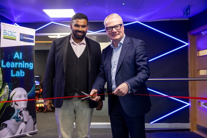 Richard Parker and Manny Athwal cutting a ribbon in an AI Learning Lab