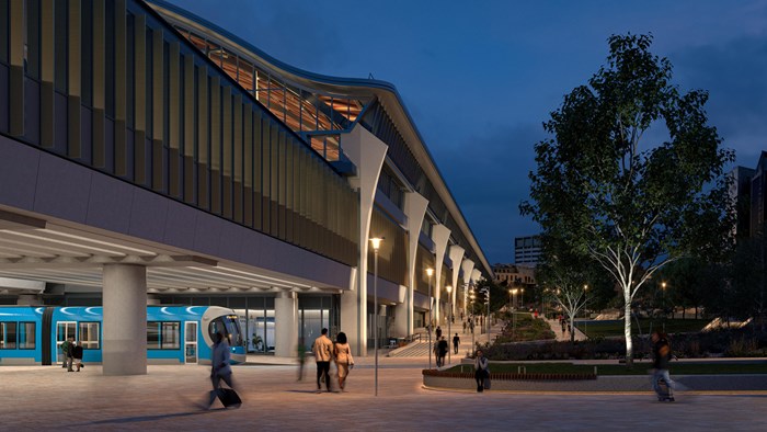 Artists design image of the elevated station with a blue tram passing underneath