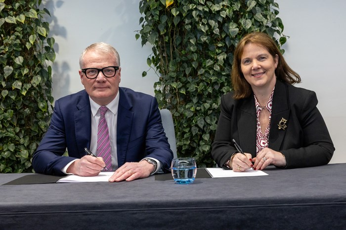 Richard Parker, Mayor of the West Midlands and Claire Ward, Mayor of the East Midlands, signing the West and East Midlands Compact.