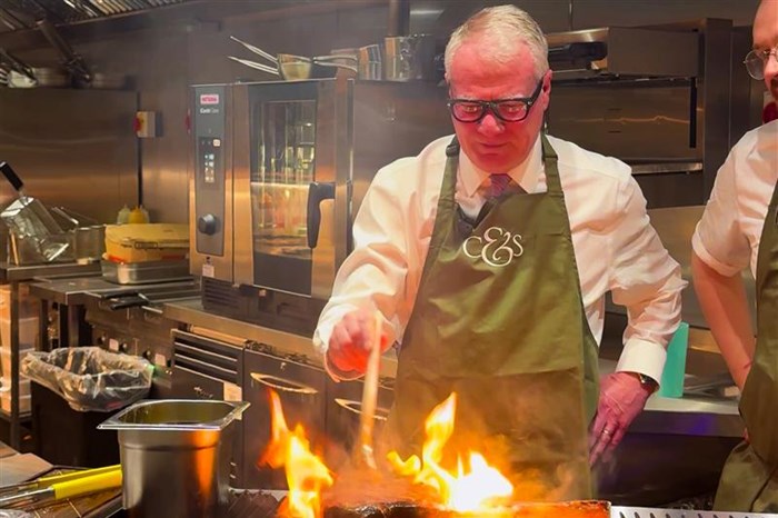 Mayor Richard Parker has a go at cooking a steak in Cow & Sow’s kitchen
