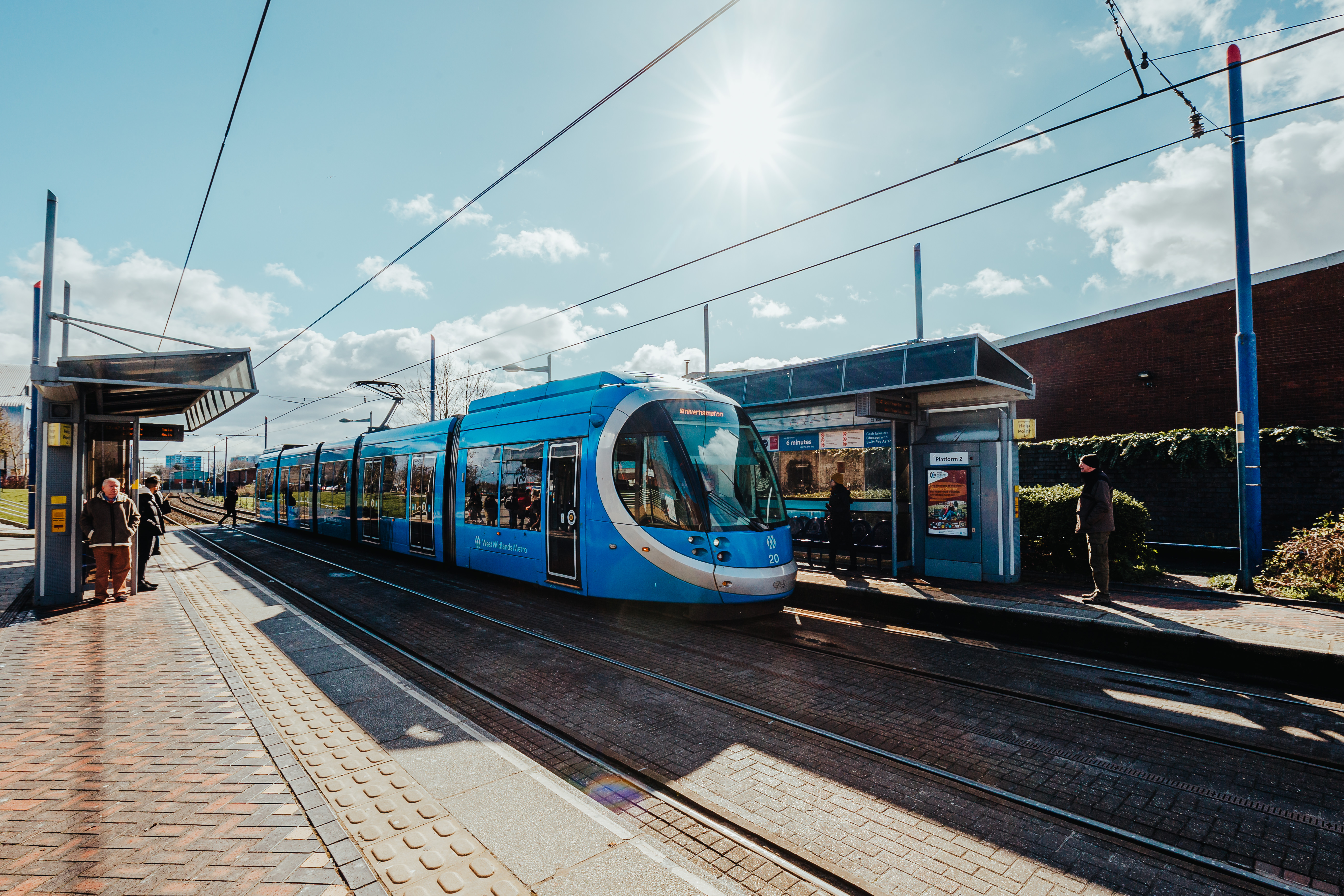 West Midlands Metro blue tram at a stop