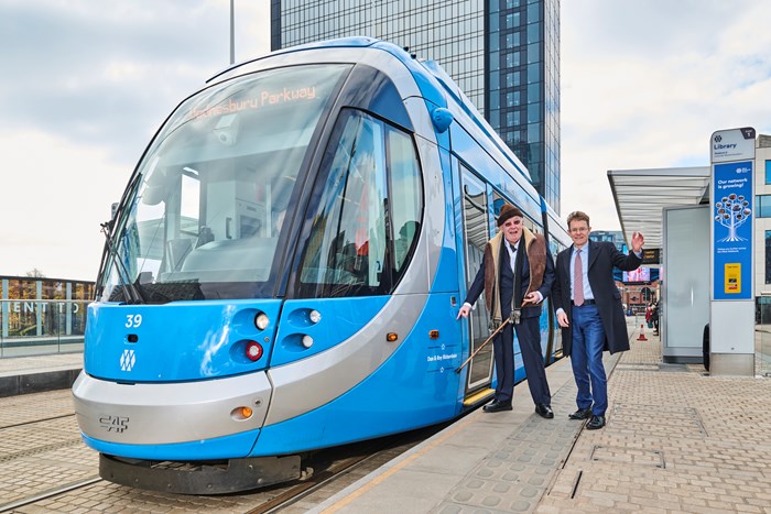 Roy Richardson and Mayor Andy Street name the tram in Centenary Square, Birmingham