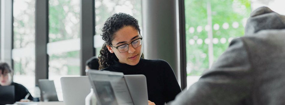 Woman at a laptop in an office space