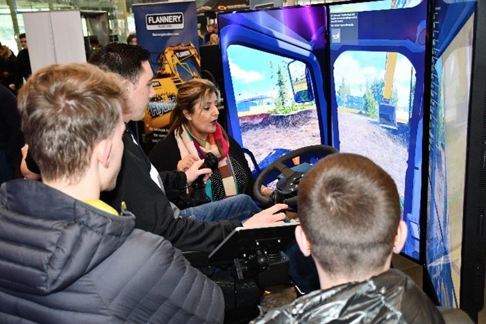 HS2 career live event - three young people at a train simulator