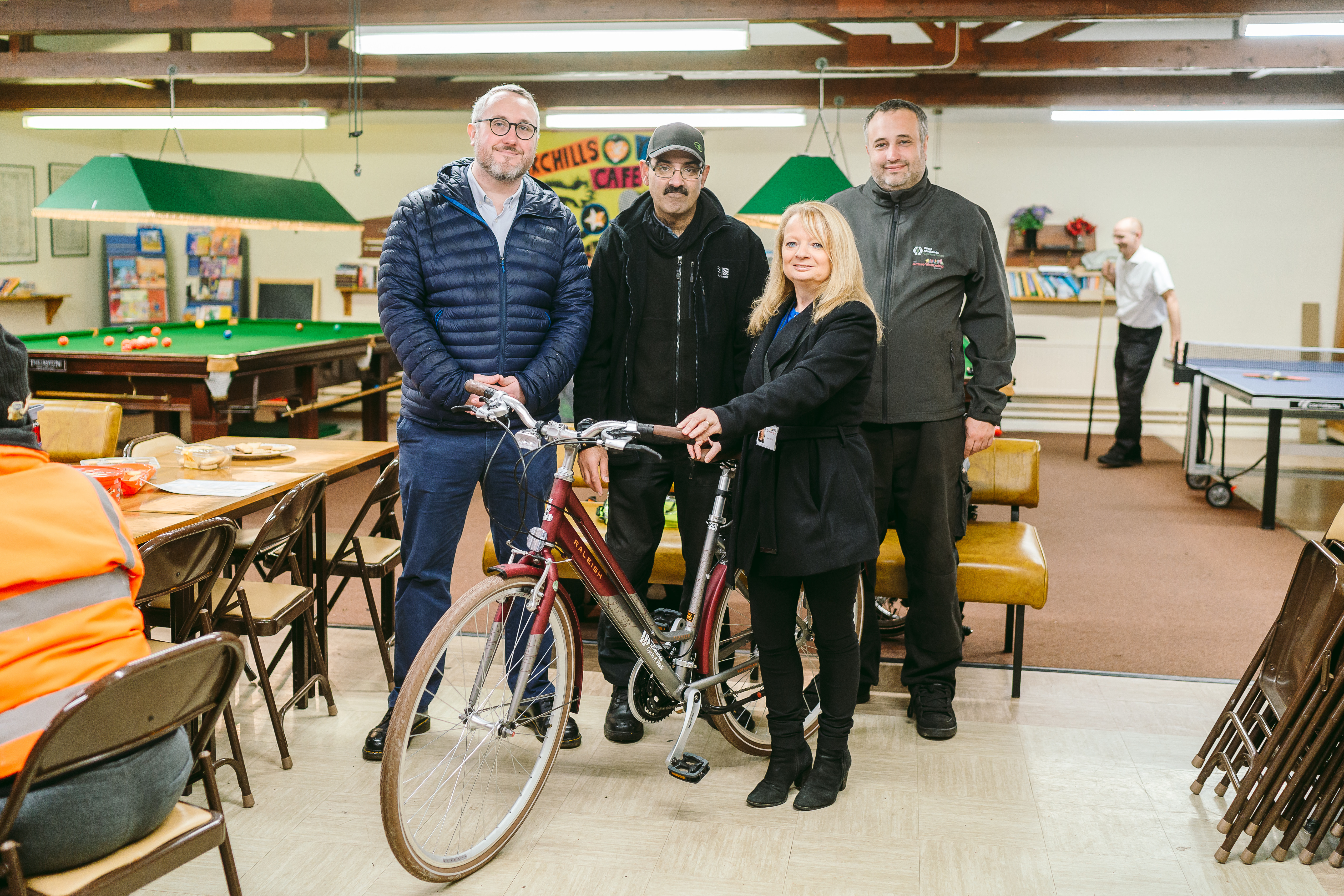 West Midlands cycling and walking commissioner Adam Tranter, Shokt Fazal of Agenda 21, Sue Mellor and Tom Holness of The Active Wellbeing Society with one of the new Raleigh bikes at the Agenda 21 community centre in Birchills