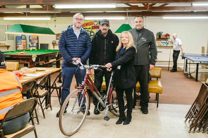 West Midlands cycling and walking commissioner Adam Tranter, Shokt Fazal of Agenda 21, Sue Mellor and Tom Holness of The Active Wellbeing Society with one of the new Raleigh bikes at the Agenda 21 community centre in Birchills