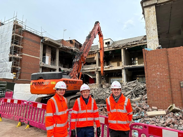 Demolition machine at work on the building