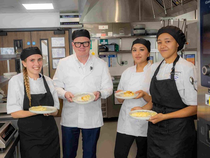 (left to right), Summer Osbourne, Mayor Richard Parker, Maya Amir, and Amia Fishley taking part in an omelette making challenge