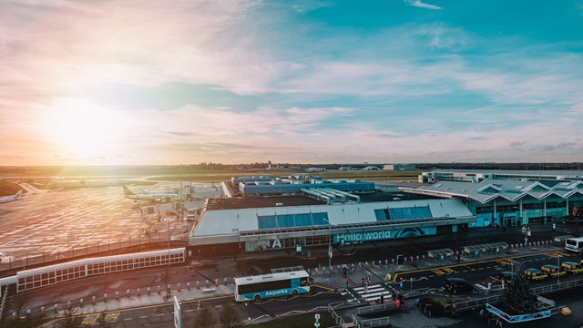 Ariel image of birmingham airport with the sun setting in the background