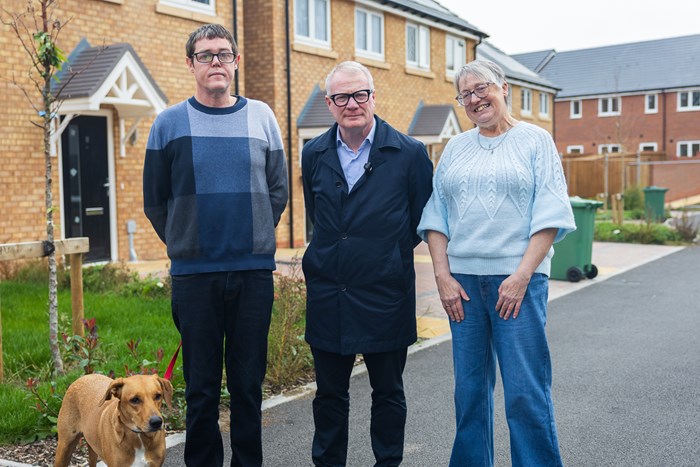 Richard Parker, Mayor of the West Midlands (centre) with social housing tenants David Hopper, his dog Honey and Sue Khan
