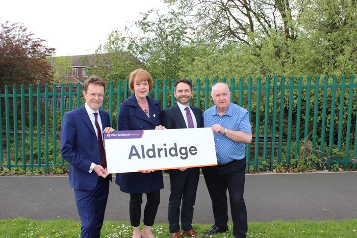 Standing at the proposed Aldridge Railway station site, with railway line in background are West Midlands Mayor Andy Street, Aldridge and Brownhills MP Wendy Morton, director of rail for TfWM Tom Painter and Walsall Council leader Cllr Mike Bird