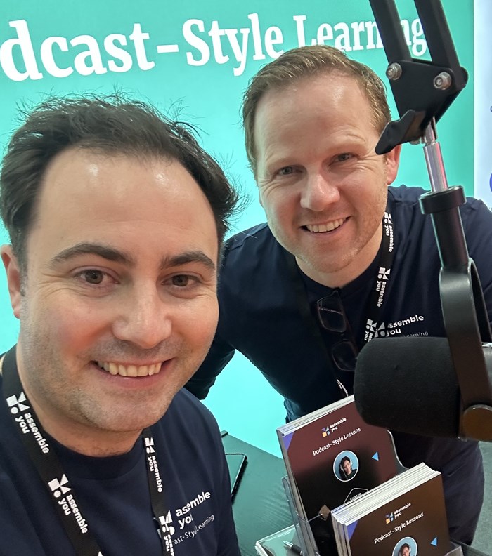 Two founders in a recording studio in front of the microphone
