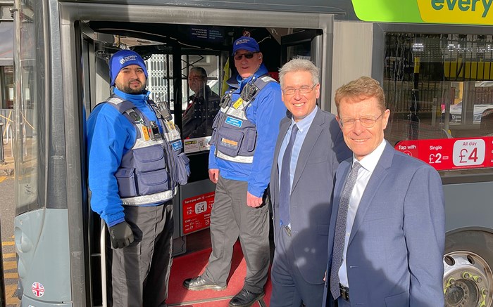 Two transport safety officers alongside Simon Foster, police and crime commissioner for West Midlands and Andy Street, Mayor of the West Midlands and chair of the WMCA.