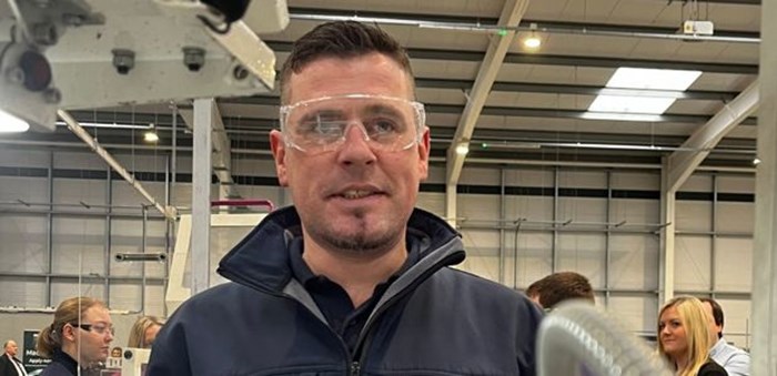 Max wearing some protective goggles in an engineering lab