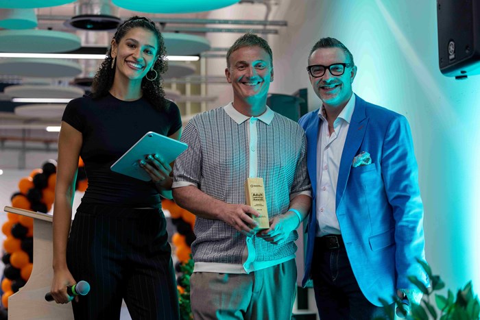 Adam Pickett (centre) with apprentice Santina Bunting (left) and Ed James being presented the Community Learning Champion Adult Learner Award
