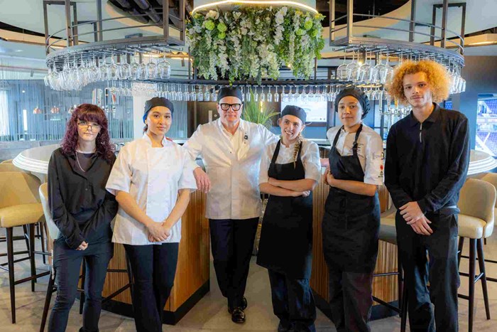 Compass Group UK & Ireland apprentices, Sidney Hall, Maya Amir, Mayor Richard Parker, Summer Osbourne, Amia Fishley and Declan Bonefield in the hospitality suite at Birmingham City Football Club