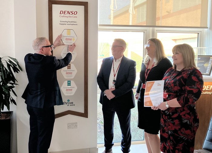 Richard Parker awarding DENSO Automotive Ltd with their Thrive at Work Gold Accreditation