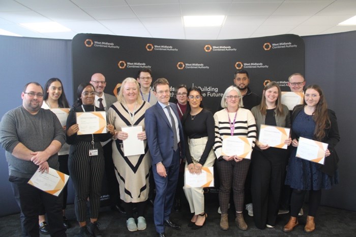 Andy Street, Mayor of the West Midlands (middle) with WMCA apprentices (L to R) Andrew Oram-Lewis; Navreeta Khangura; Paige Hinds; Warren Eden-Williams; Fiona Latter; Ben Cloney; Natasha Rice; Hema Ghale; Carolyn Harris; Nikhil Vadukul; Catherine Rooney; Matthew Savin and Louise Bown.