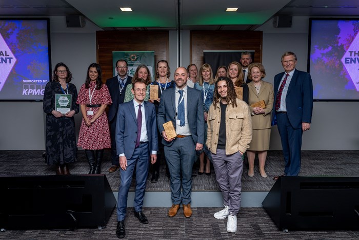 The Mayor of the West Midlands and the winners of the 2023 West Midlands Natural Environment Awards smiling at the camera holding their trophies.