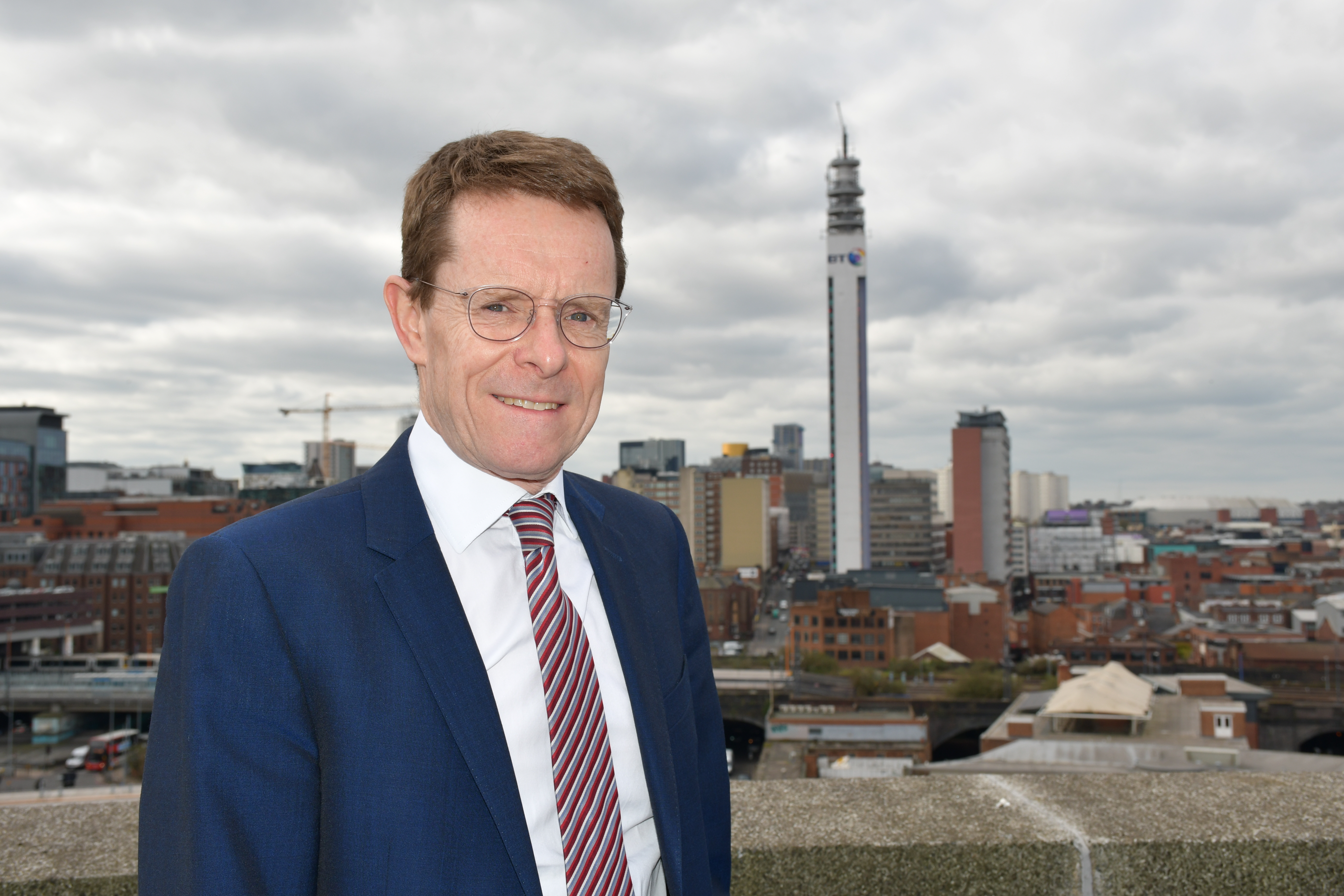 Andy Street standing in front of Birmingham skyline